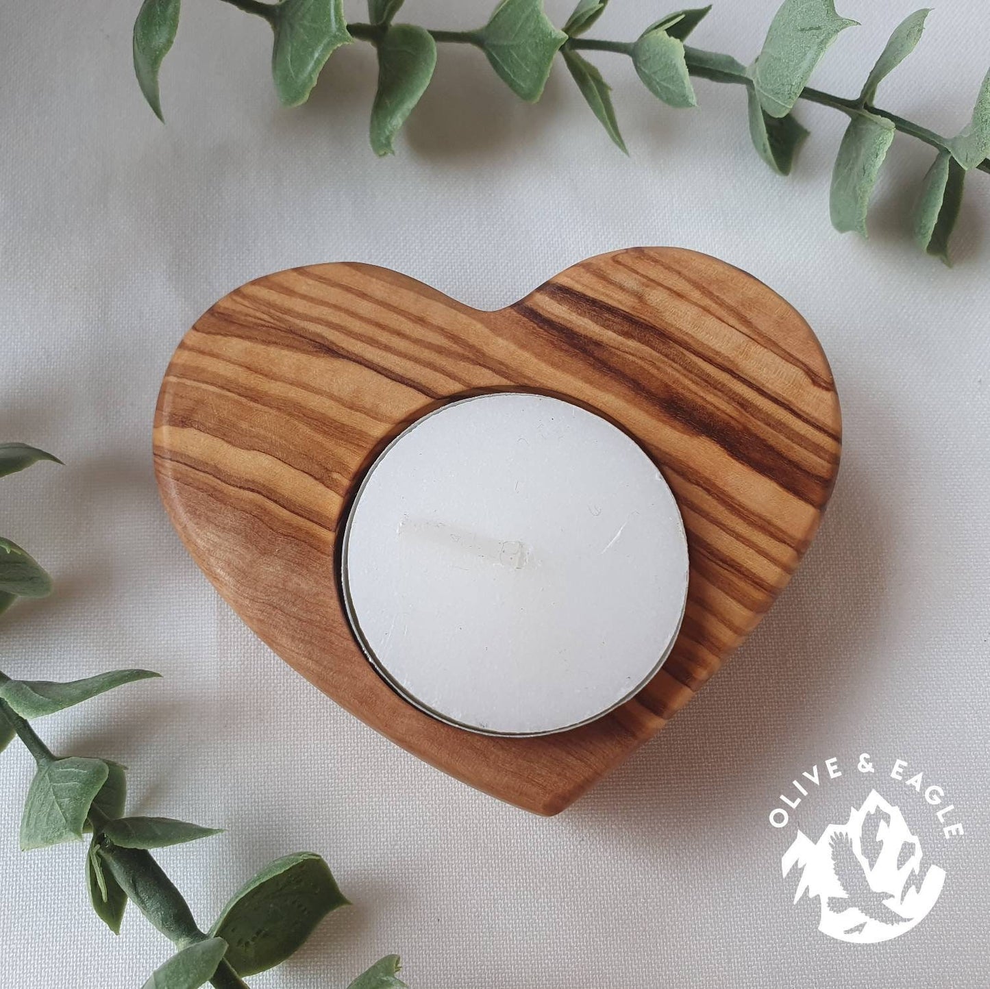 Olive wood heart tealight candle holder.