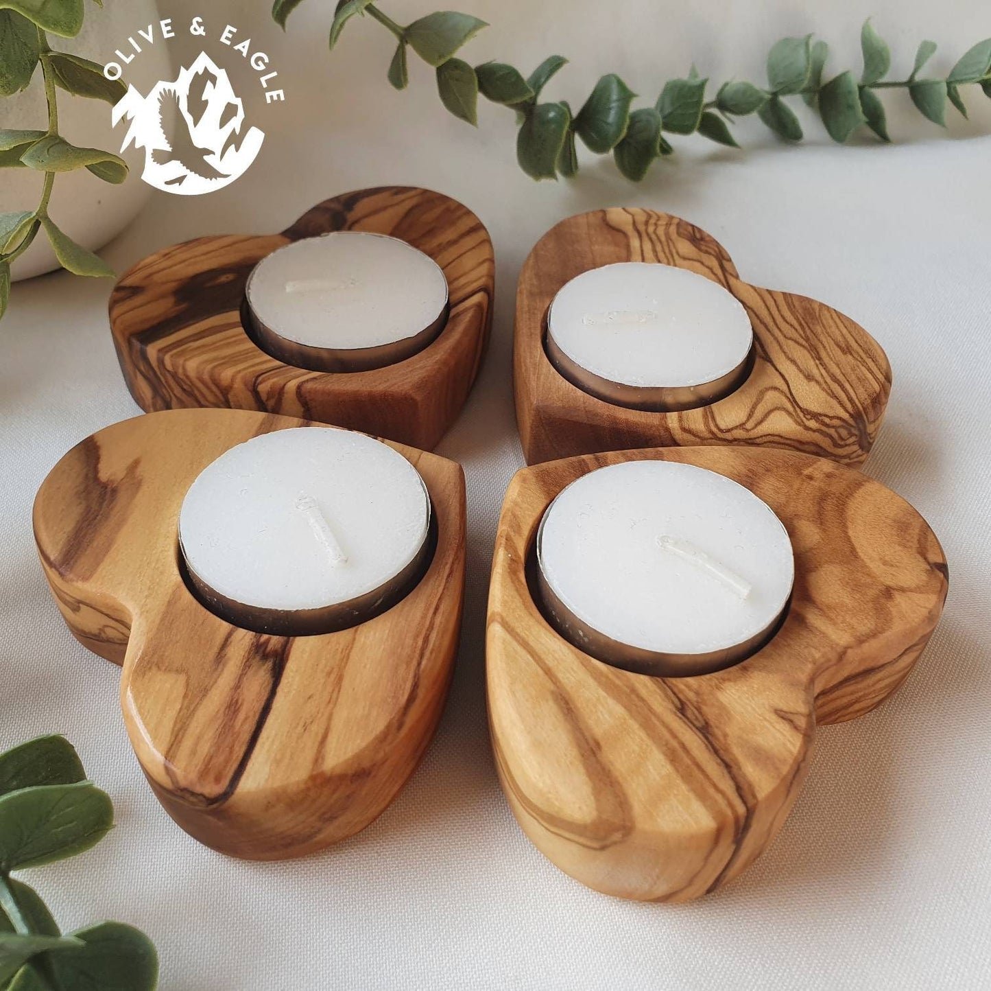 Olive wood heart tealight candle holder.