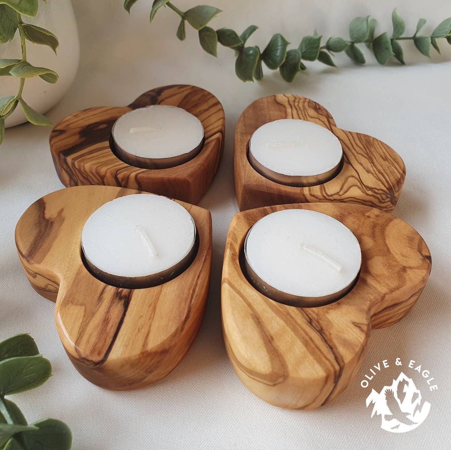 Olive wood heart tealight candle holder.